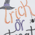 Zoom detalle bordado Trick or Treat naranja morado negro sombrero bruja araña escoba paño algodón Halloween cocina